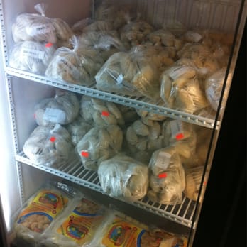 Brazilian Bakery - What appears to be frozen dough and savory take home options - Brazilian Near Me - Silver Spring, Maryland
