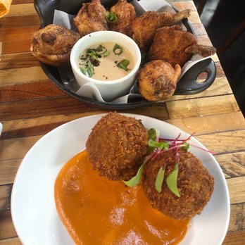 District - Crispy Spiced Chicken Wings and Fontina & Spinach Arancini - Tapas/Small Plates Near Me - San Jose, California District - Crispy Spiced Chicken Wings and Fontina & Spinach Arancini - Tapas/Small Plates Near Me - San Jose, California