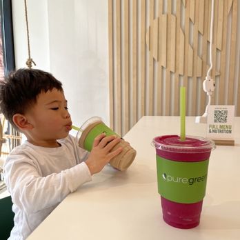 Pure Green - 2 yr old enjoying the chocolate mousse and the pink dragon is for me. - Juice Bars & Smoothies Near Me - Chicago, Illinois