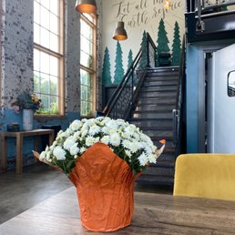 a vase of flowers on a table