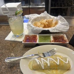 Complimentary chips and salsa  Margarita rocks Sour cream chicken enchilada
