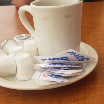 Loaded Cafe - Dirty coffee cup and it wasn't full so not like it spilled over - Breakfast & Brunch Near Me - Gardena, California
