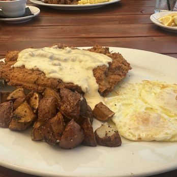 The Rackhouse - Chicken fried steak, over easy eggs, potatoes - American Near Me - The Colony, Texas The Rackhouse - Chicken fried steak, over easy eggs, potatoes - American Near Me - The Colony, Texas