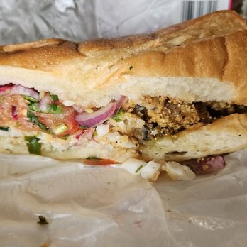 Omarcitos Latin Cafe - Fish sandwich - Latin American Near Me - Chicago, Illinois Omarcitos Latin Cafe - Fish sandwich - Latin American Near Me - Chicago, Illinois