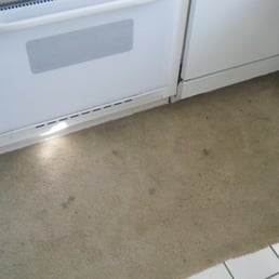 stained carpet in front of stove stained carpet in front of stove