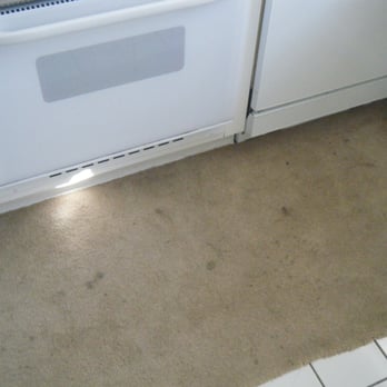 Myrtlewood Villas - stained carpet in front of stove - Resorts Near Me - Myrtle Beach, South Carolina Myrtlewood Villas - stained carpet in front of stove - Resorts Near Me - Myrtle Beach, South Carolina