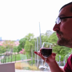 Viniční altán - My husband enjoying the house red Czech wine