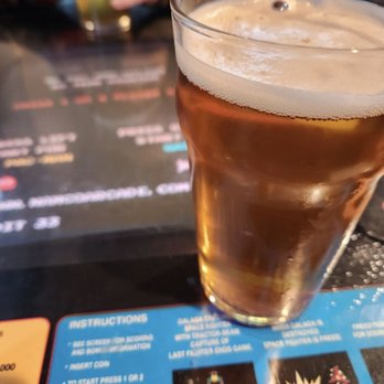 Oddwood Brewing - The Shinest Maibock beer getting a front row seat to the game playing that's about to begin. - Breweries Near Me - Austin, Texas Oddwood Brewing - The Shinest Maibock beer getting a front row seat to the game playing that's about to begin. - Breweries Near Me - Austin, Texas