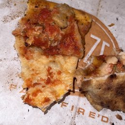 If you zoom, or look for the light reflection you can clearly see the brown (straight) hair in the pizza If you zoom, or look for the light reflection you can clearly see the brown (straight) hair in the pizza