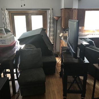 Carpet City - a cluttered living room and kitchen - Carpeting Near Me - Green Bay, Wisconsin