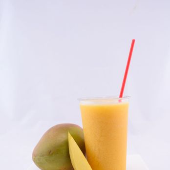 QMart - a mango smoothie and a mango slice - Tex-Mex Near Me - Houston, Texas QMart - a mango smoothie and a mango slice - Tex-Mex Near Me - Houston, Texas