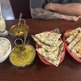 big bowl of basmati rice, mutter paneer, dal tadka, GARLIC NAAN, ONION KULCHA, and mango lassi that is gone already. big bowl of basmati rice, mutter paneer, dal tadka, GARLIC NAAN, ONION KULCHA, and mango lassi that is gone already.