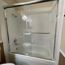 a bathroom with a tub and toilet