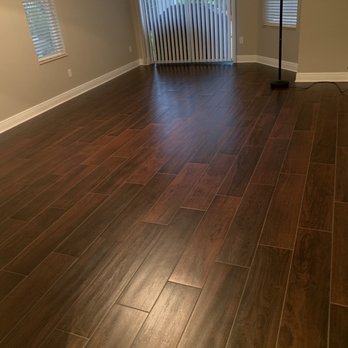 Express Affordable Flooring - a hardwood floor in a living room - Flooring Near Me