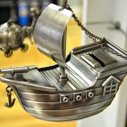 A Special Gift - Store those pieces of eight in this fun pirate ship bank. We engrave on the attached sail.