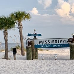 Gulfport Beach - 09.01.19 "Welcome to the Mississippi Gulf Coast" sign sits in the middle of the coast on the beach. Located at the south end of Cowan Road
