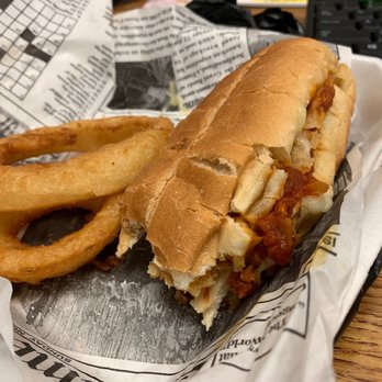 Mimosa's - Chicken parmesan sandwich and onion rings. I ate half of it before taking the picture. Lol. It was delicious! - Breakfast & Brunch Near Me - Englewood, Florida
