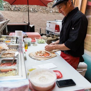 Woodfire Pizza Wagon - Greg working his magic at our wedding. - Pizza Near Me Woodfire Pizza Wagon - Greg working his magic at our wedding. - Pizza Near Me