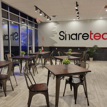 Sharetea - a restaurant with tables and chairs - Bubble Tea Near Me - Shenandoah, Texas