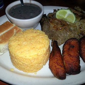Cuban Breezes - Vaca Frita (shredded skirt steak topped with grilled onions) with yellow rice, black beans, plaintains, and Cuban bread - Cuban Near Me - Tampa, Florida Cuban Breezes - Vaca Frita (shredded skirt steak topped with grilled onions) with yellow rice, black beans, plaintains, and Cuban bread - Cuban Near Me - Tampa, Florida