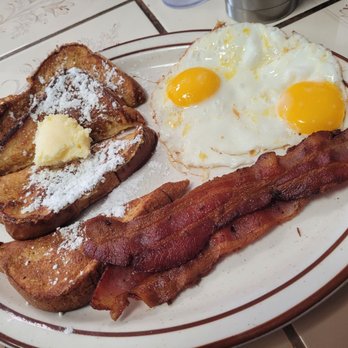 Carla's Cafe - French Toast, Sunny side up eggs, with Bacon. The French toast was delicious and soo was the Bacon. - Diners Near Me - Bakersfield, California