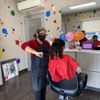 Trims & Tangles - Miss Juanita giving my daughter the first cut in the new salon! - Kids Hair Salons Near Me - Lake Forest, California Trims & Tangles - Miss Juanita giving my daughter the first cut in the new salon! - Kids Hair Salons Near Me - Lake Forest, California