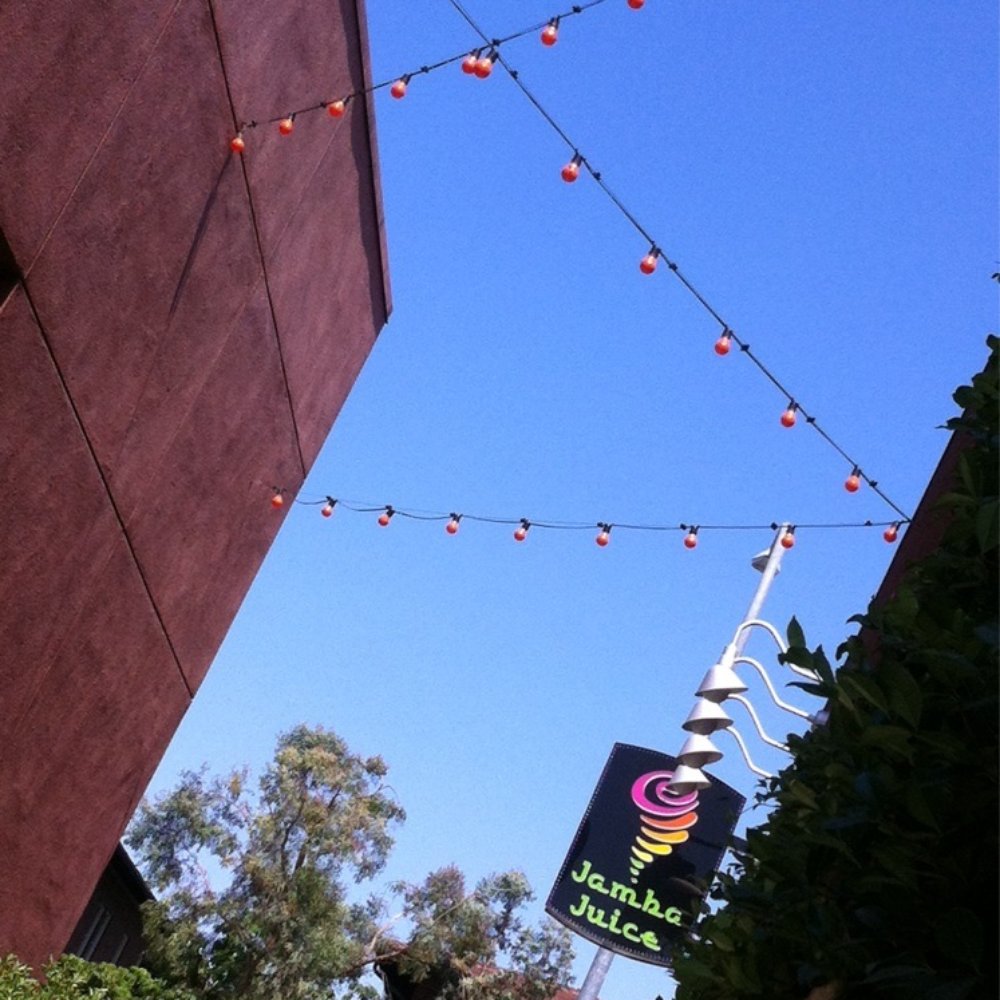 Jamba - Breezy patio tables between Jamba and the building next door. - Juice Bars & Smoothies Near Me - Alhambra, California