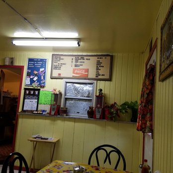 Tako Hut - a yellow dining room with a yellow table and chairs - Mexican Near Me - Rio Grande City, Texas