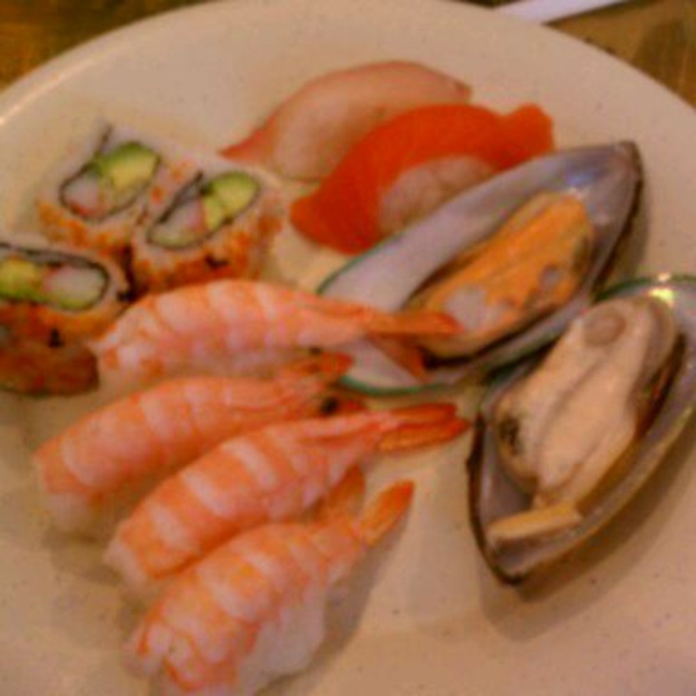 a plate of seafood and sushi a plate of seafood and sushi