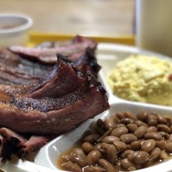 Buzzie's Bar-B-Q - Ribs on top of brisket with beans and potato salad.