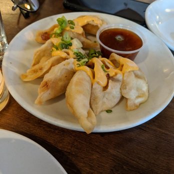 Friedman's - Vegetarian potstickers. The sriracha mayo on top was delectable. They were perfectly crispy - Breakfast & Brunch Near Me - New York, New York Friedman's - Vegetarian potstickers. The sriracha mayo on top was delectable. They were perfectly crispy - Breakfast & Brunch Near Me - New York, New York