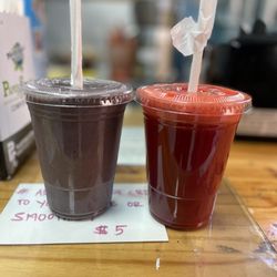 Madhufalla Organic Juice & Smoothie Bar - Açaí protein smoothe(left) , cleanser juice (right)