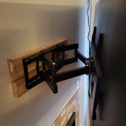 Honey-Do Handyman - The bracket didn't work with the wall, so we improvised and got this up. We never see the wood.