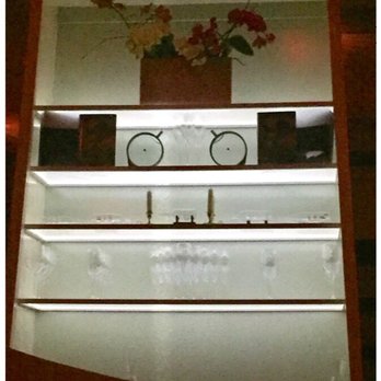 The Aviary - Wall case with glassware displays - Cocktail Bars Near Me - Chicago, Illinois The Aviary - Wall case with glassware displays - Cocktail Bars Near Me - Chicago, Illinois