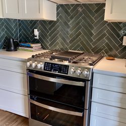 Bedrock Quartz - Countertops with herringbone backsplash
