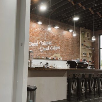 Junction Coffee - a brick wall and bar area - Food Trucks Near Me Junction Coffee - a brick wall and bar area - Food Trucks Near Me