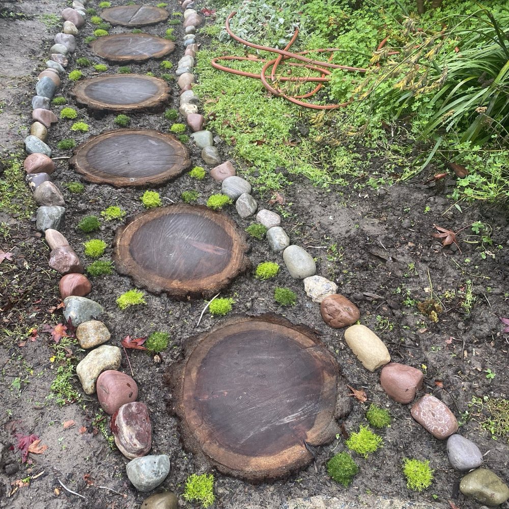 Speedy Gonzalez Landscapes -  pathway made of tree stumps - Landscaping Near Me