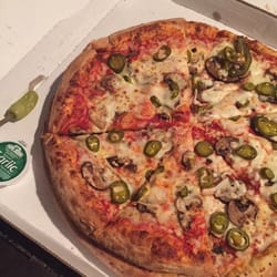 Papa Johns Pizza - Large pizza half sitting on top of an XL pizza - disappointing because I think papa johns is the best of the pizza chains