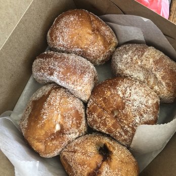 Leonard's Bakery - 3 Original malasada  ($1.25 each) & Custard, macadamia, dobash Malasada filled puff ($1.60 each) - Bakeries Near Me - Honolulu, Hawaii