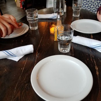 Poquitos - ._. That wood and chairs were sticky. Like paint fresh sticky. - Mexican Near Me - Seattle, Washington