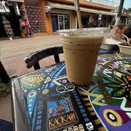 Peanut butter iced coffee and small chocolate bar.