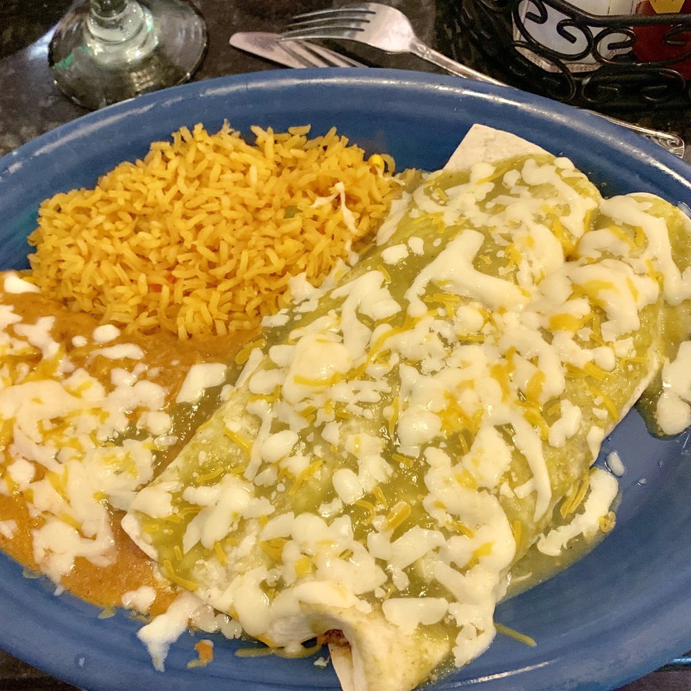Burrito with chili Verde sauce and rice and beans Burrito with chili Verde sauce and rice and beans