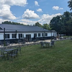 Old 690 Brewing Company - Large outdoor seating area with fire pits