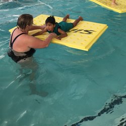 Bubbles Swim School - Playing on a mat on "fun day".