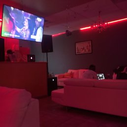 a living room with two couches and a flat screen tv