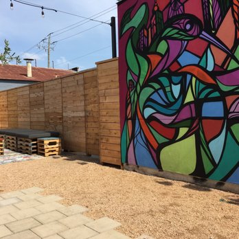FM Kitchen & Bar - Nice mural and pallet furniture in the patio area. - Bars Near Me - Houston, Texas FM Kitchen & Bar - Nice mural and pallet furniture in the patio area. - Bars Near Me - Houston, Texas