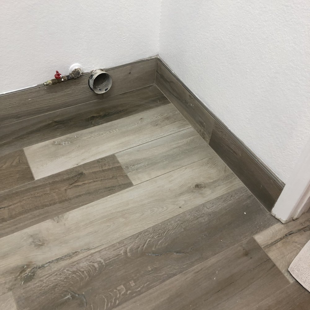 Pacific West Flooring - Tile "baseboards" in the utility room. - Flooring Near Me - Las Vegas, Nevada Pacific West Flooring - Tile "baseboards" in the utility room. - Flooring Near Me - Las Vegas, Nevada