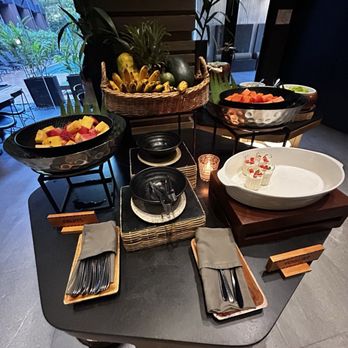 The Funny Lion - Sweets table at breakfast, lots of yummy fruit and options - Hotels Near Me - El Nido, PLW