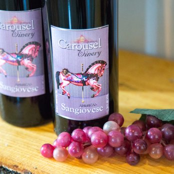Carousel Winery - two bottles of wine and grapes - Wineries Near Me - Mitchell, Indiana