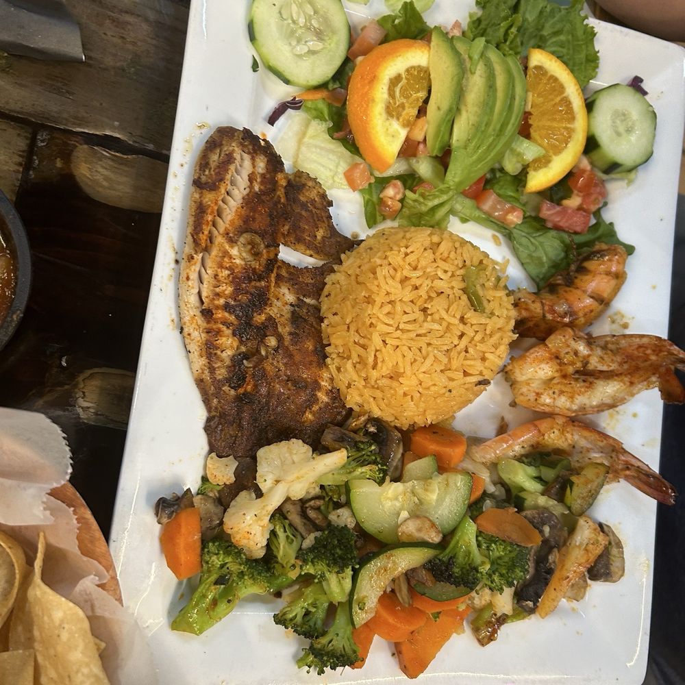 El Refu - Here my dad ordered fish fillet that came with shrimps, salad, rice, and a good veggie stir:) - Tex-Mex Near Me - Port Arthur, Texas